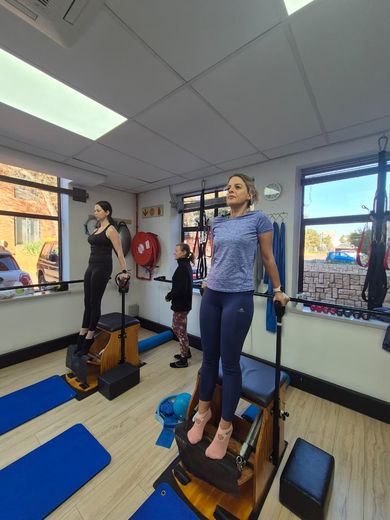 Clients standing on the chairs, pressing into the handles