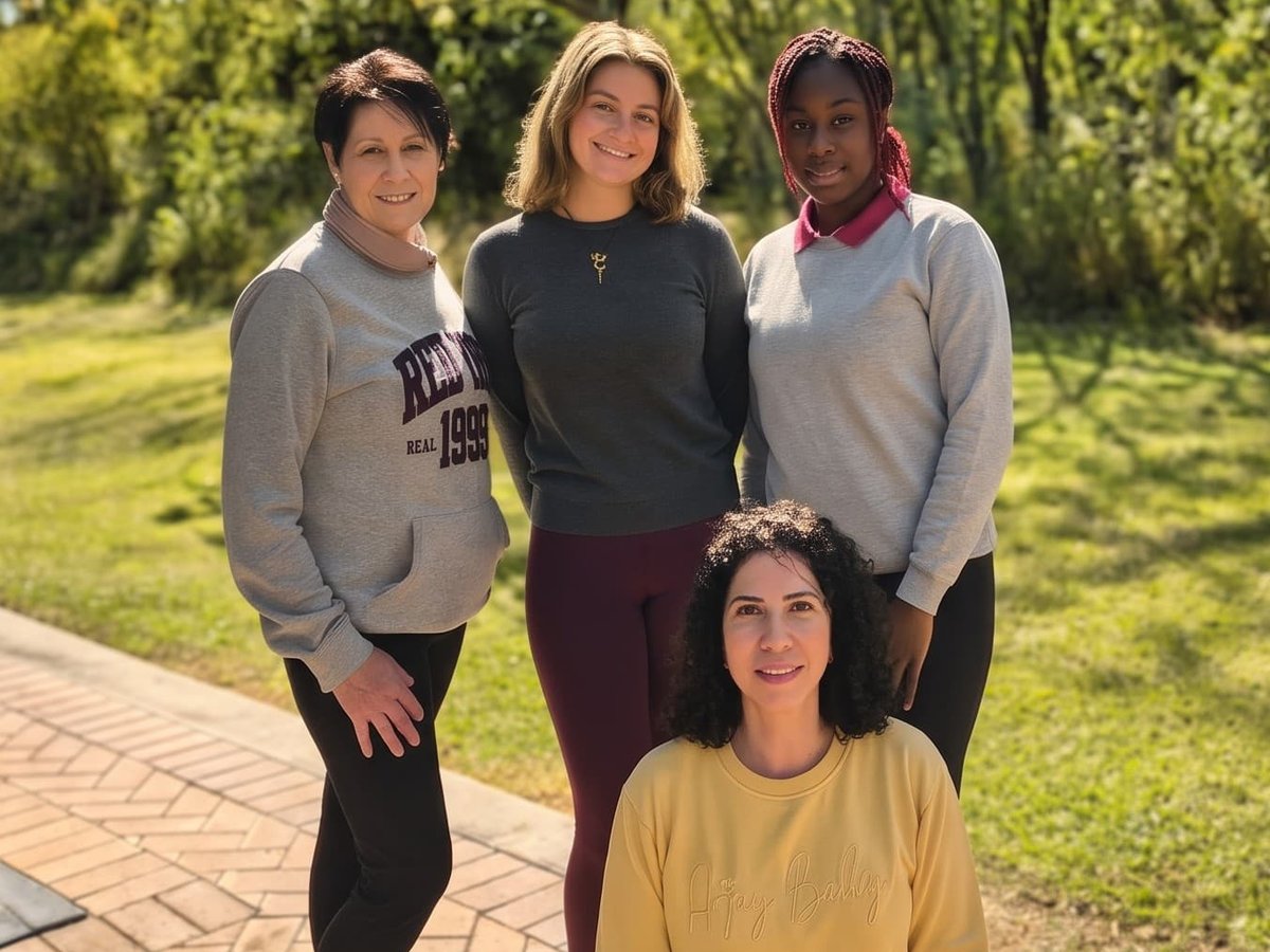 The Pilates Dynamics team in the garden beside the studio
